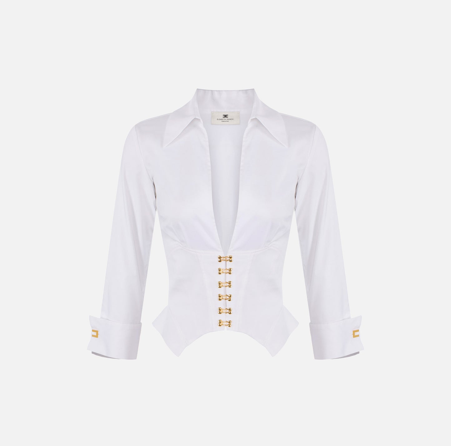 Blusa blanca con botones dorados