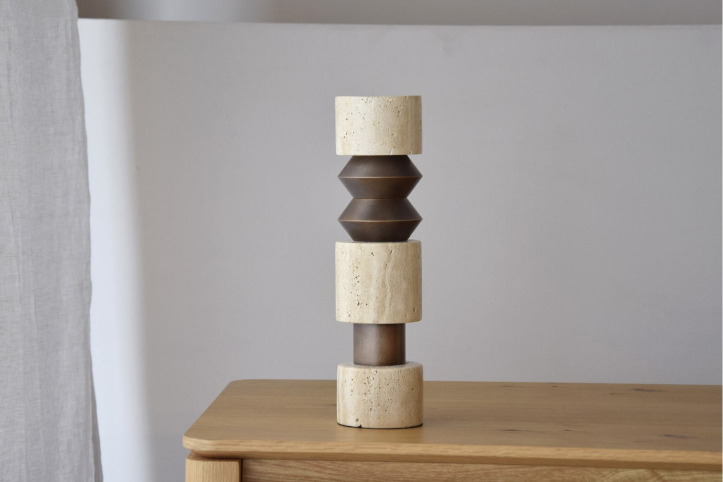 FORMA N1 CANDLE HOLDER. TRAVERTINE AND METAL.