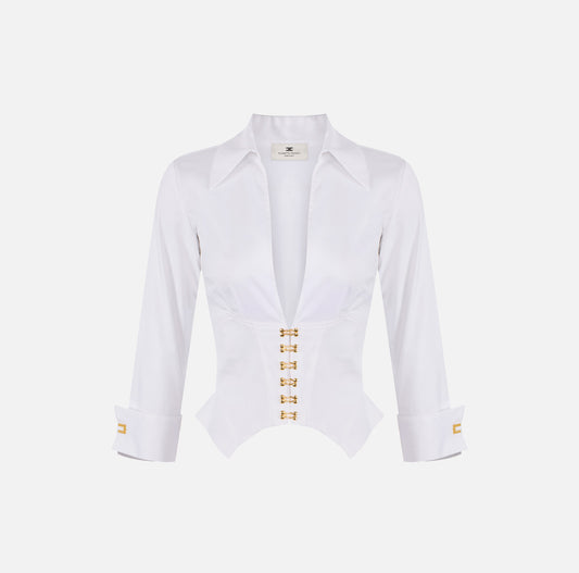 Blusa blanca con botones dorados